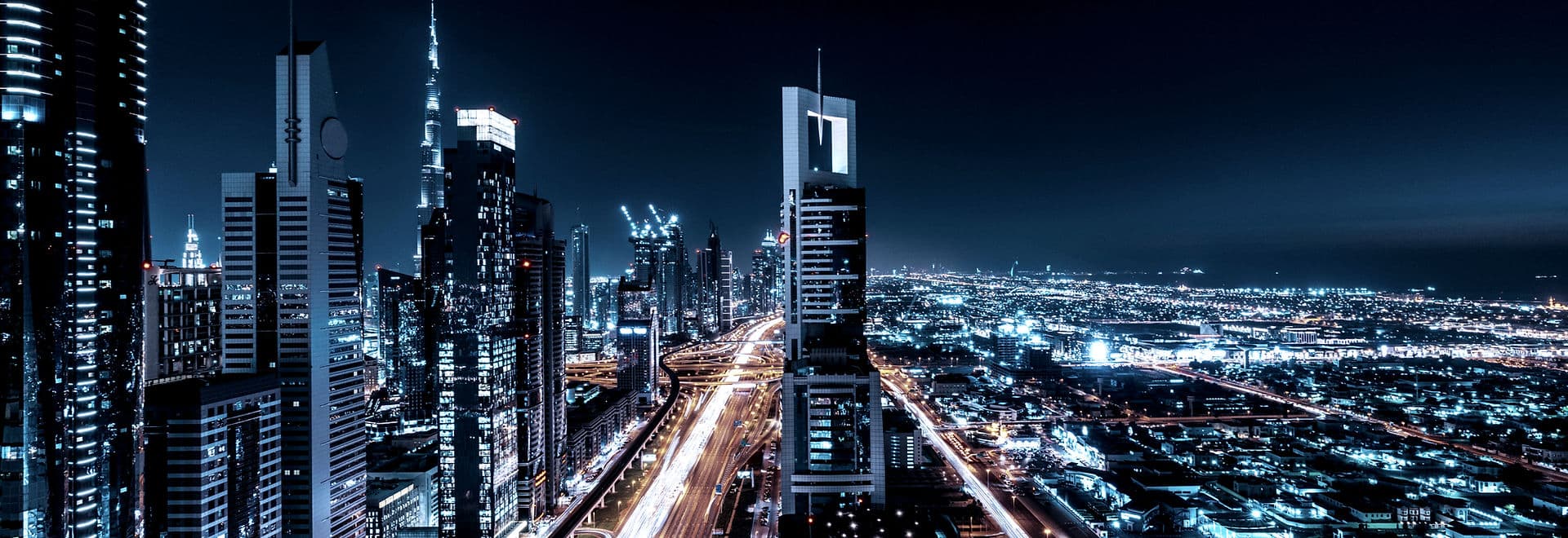 City skyline at night representing global business connections
